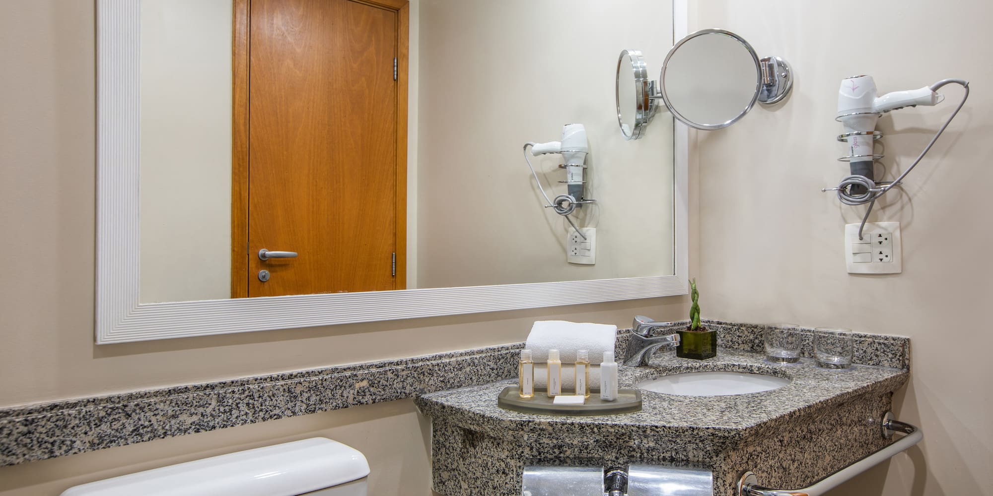 a bathroom with a mirror and sink