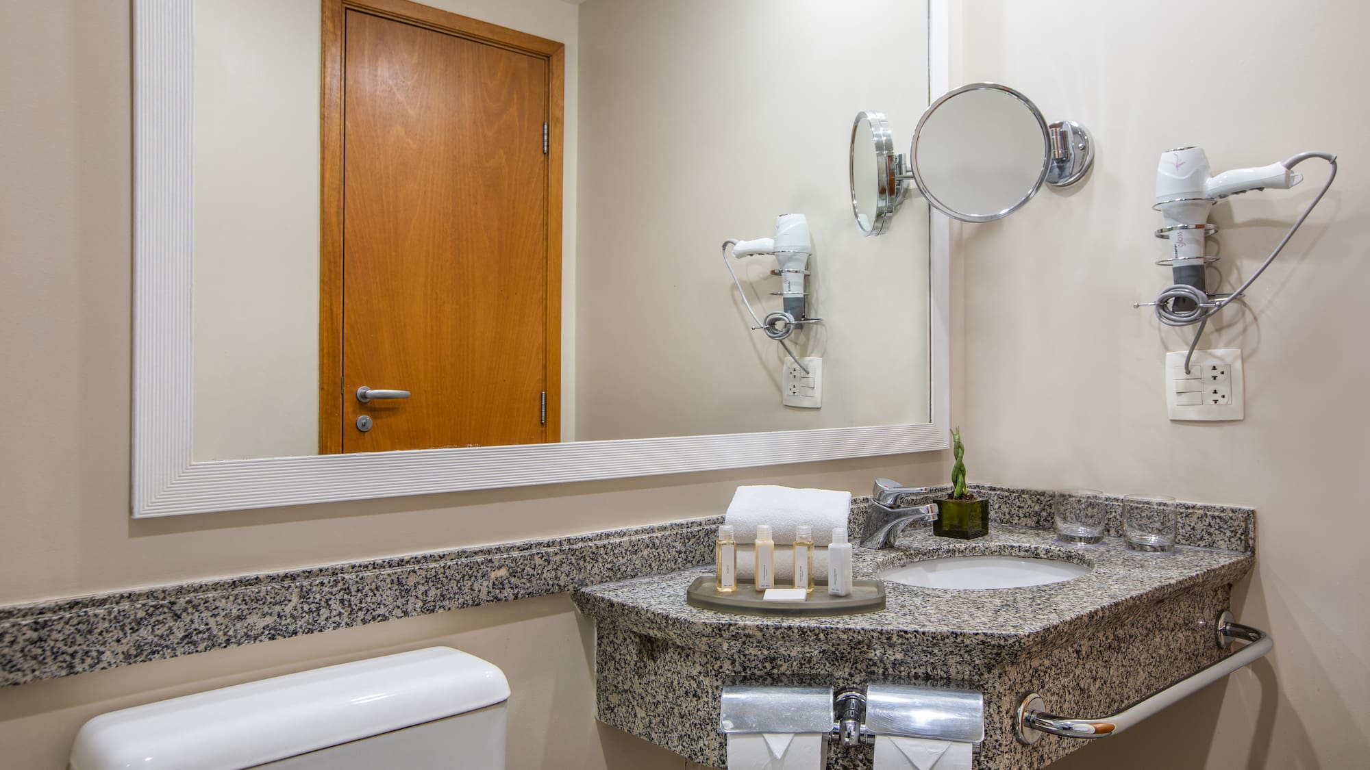 a bathroom with a mirror and sink