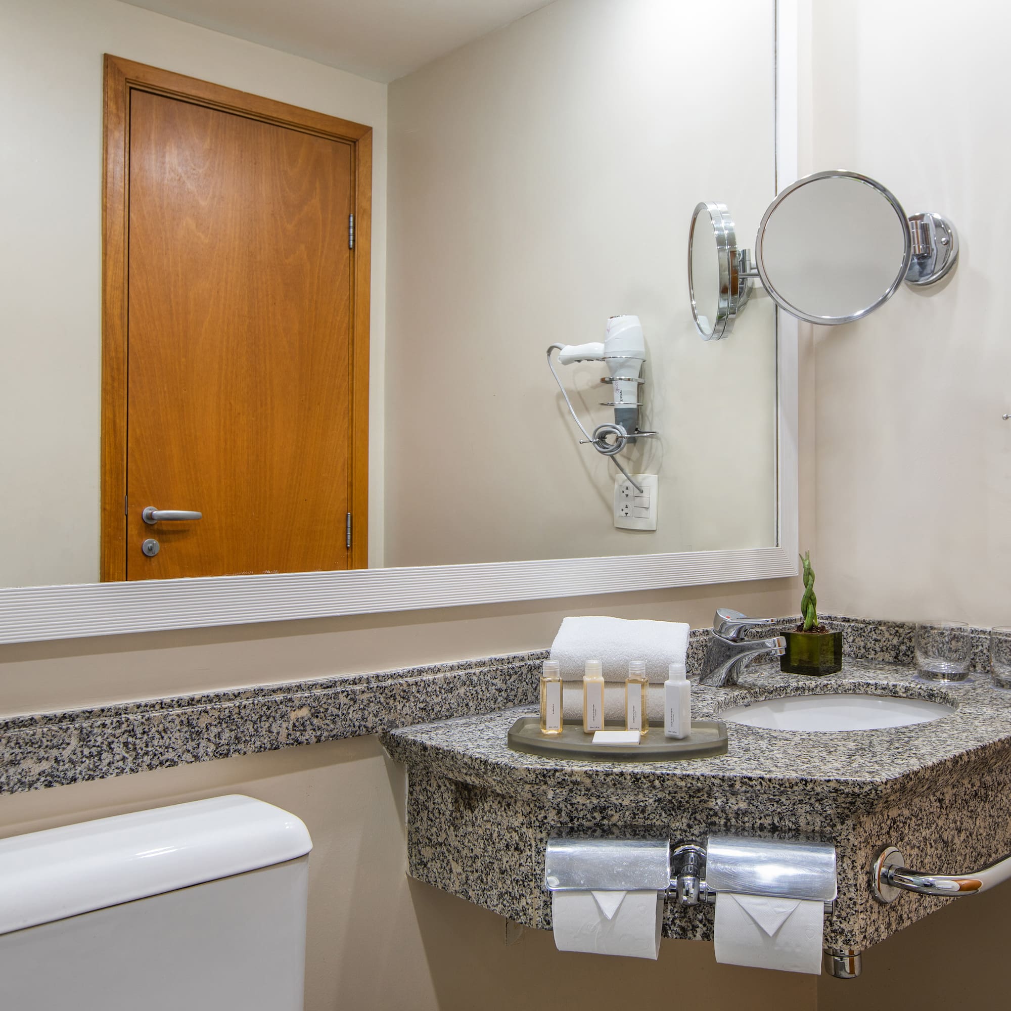 a bathroom with a mirror and sink