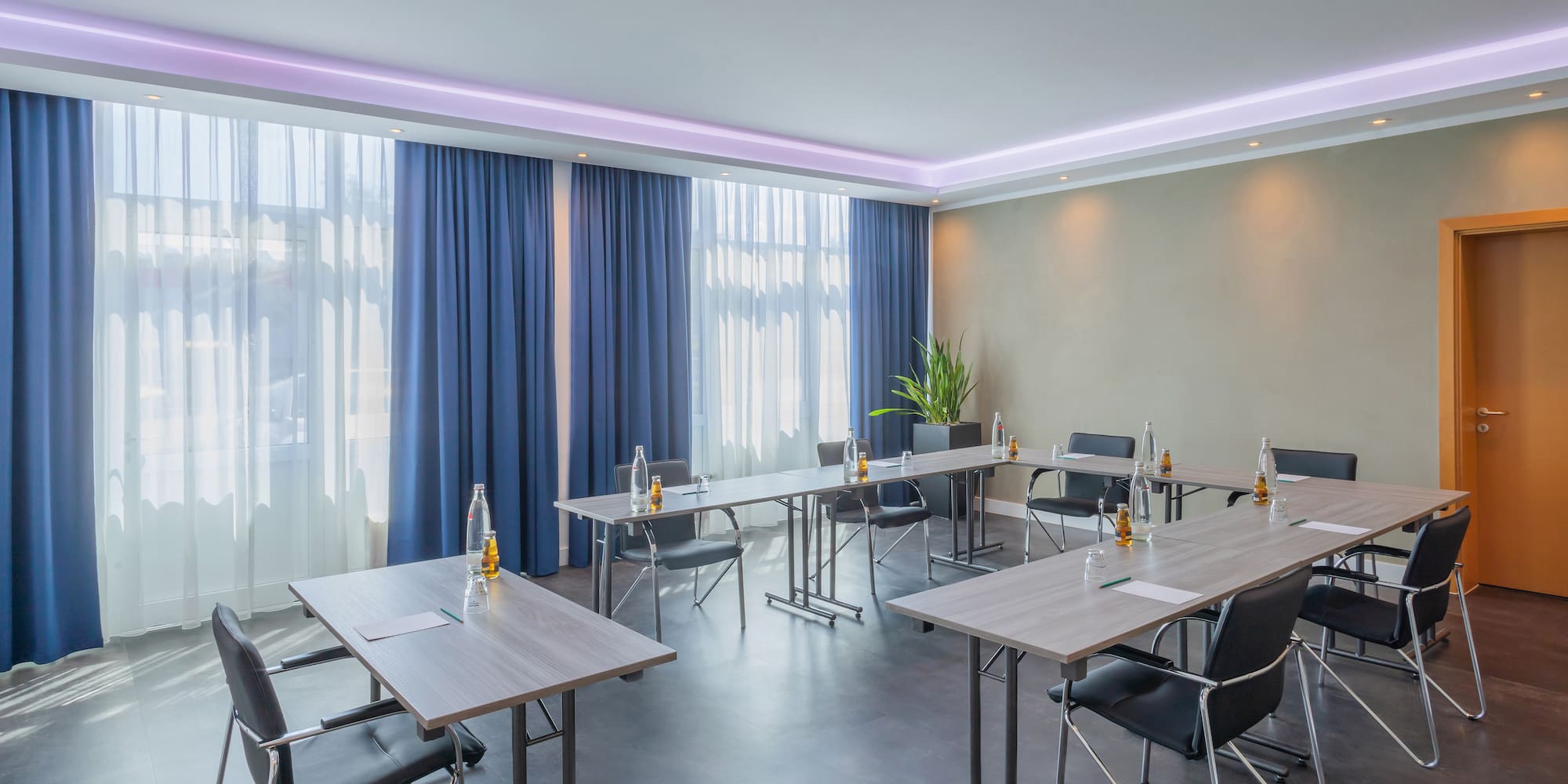 a room with tables and chairs