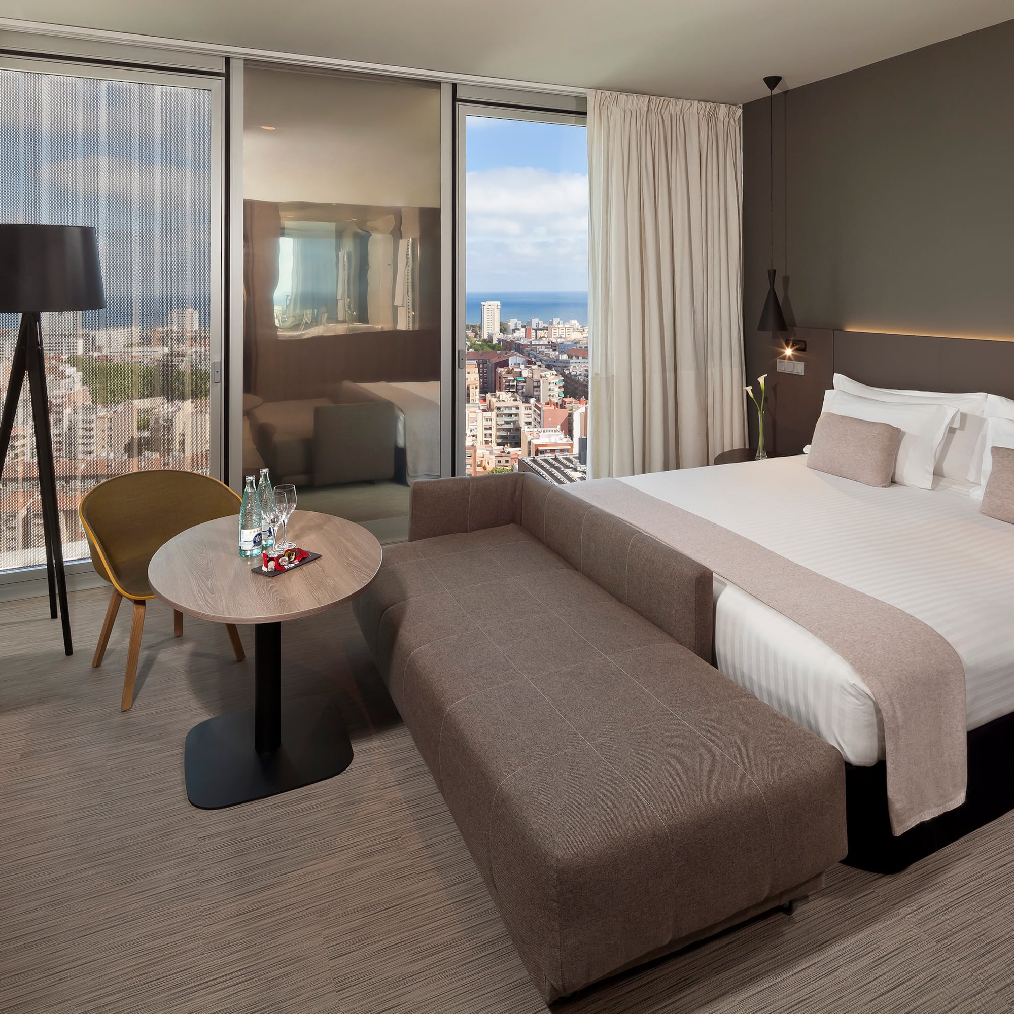 a hotel room with a bed and a table