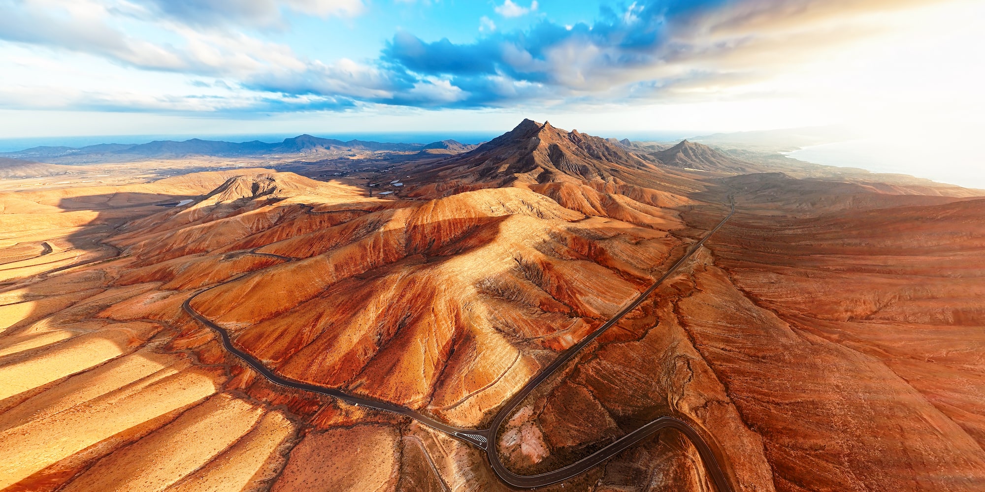 Aerial view of winding road through arid desert mountains, Fuerteventura.