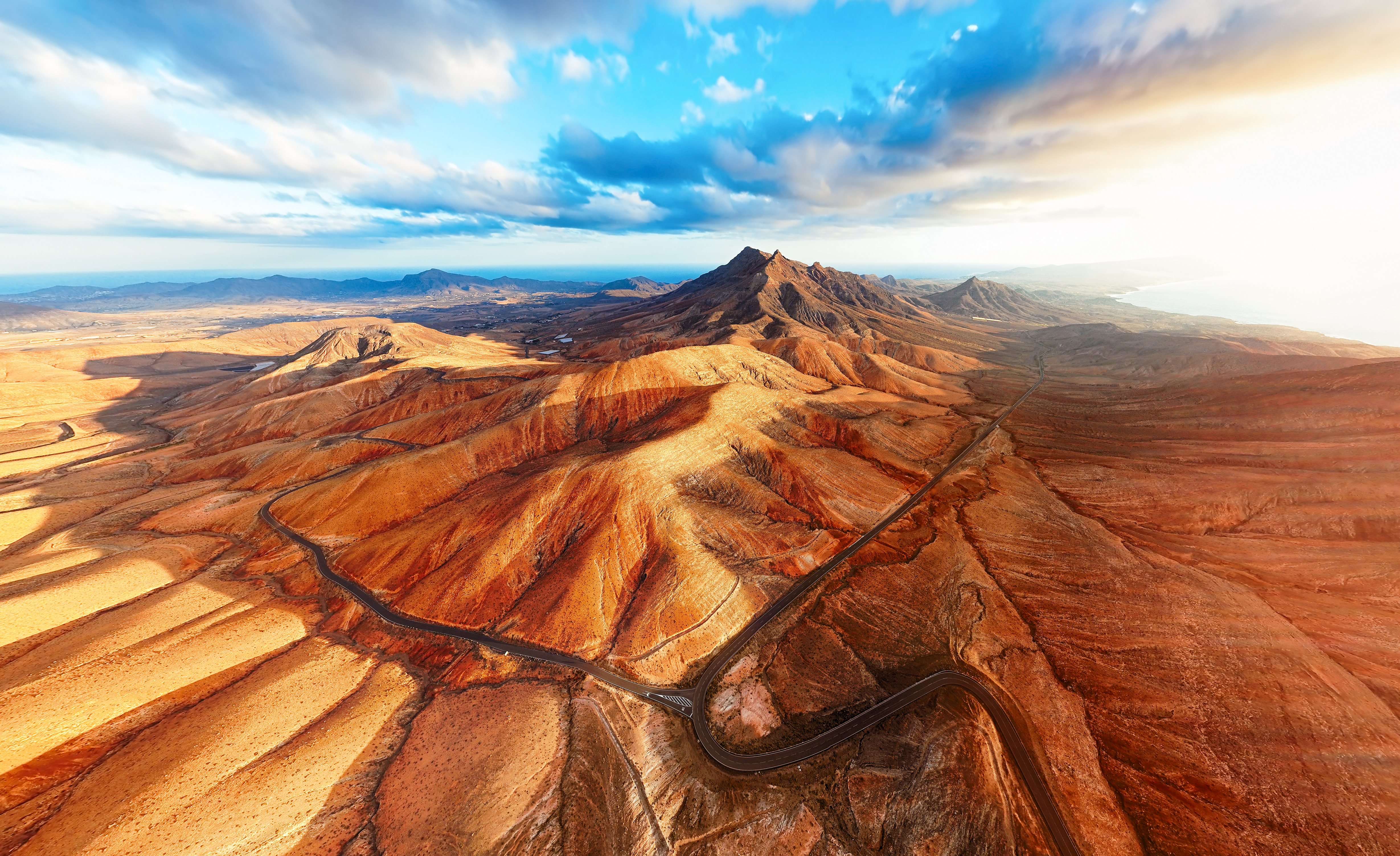 Aerial view of winding road through arid desert mountains, Fuerteventura.