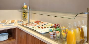 a buffet table with food and drinks
