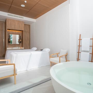 a room with a tub and a bathtub