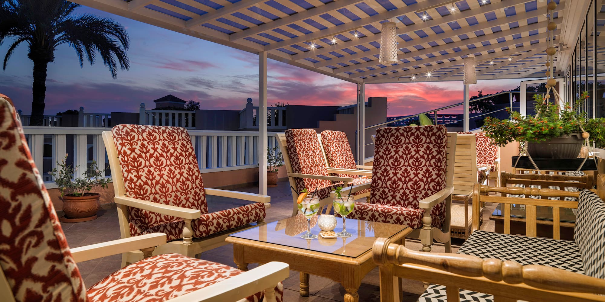 a patio with chairs and a table