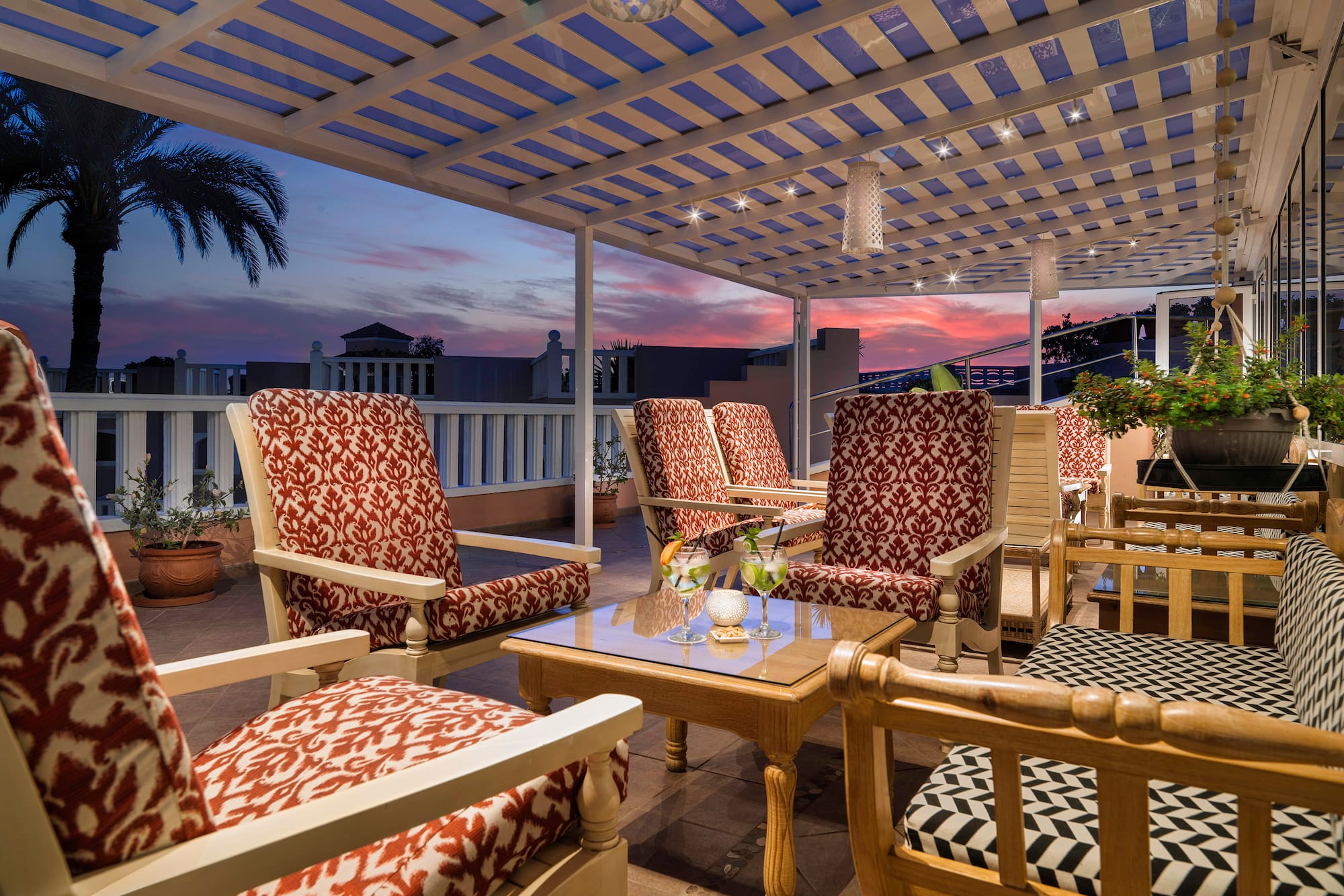a patio with chairs and a table
