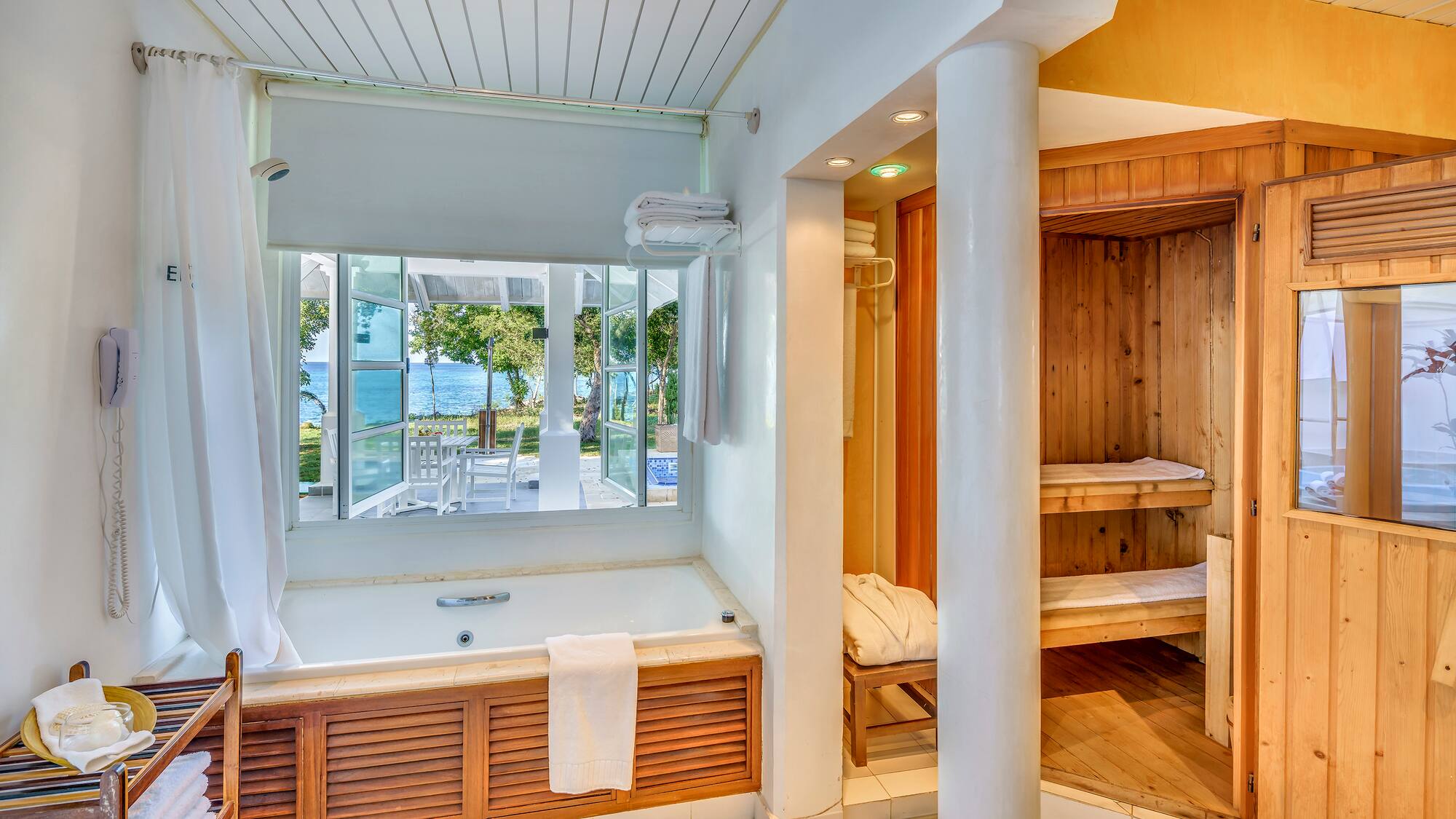 a bathroom with a bathtub and a tub