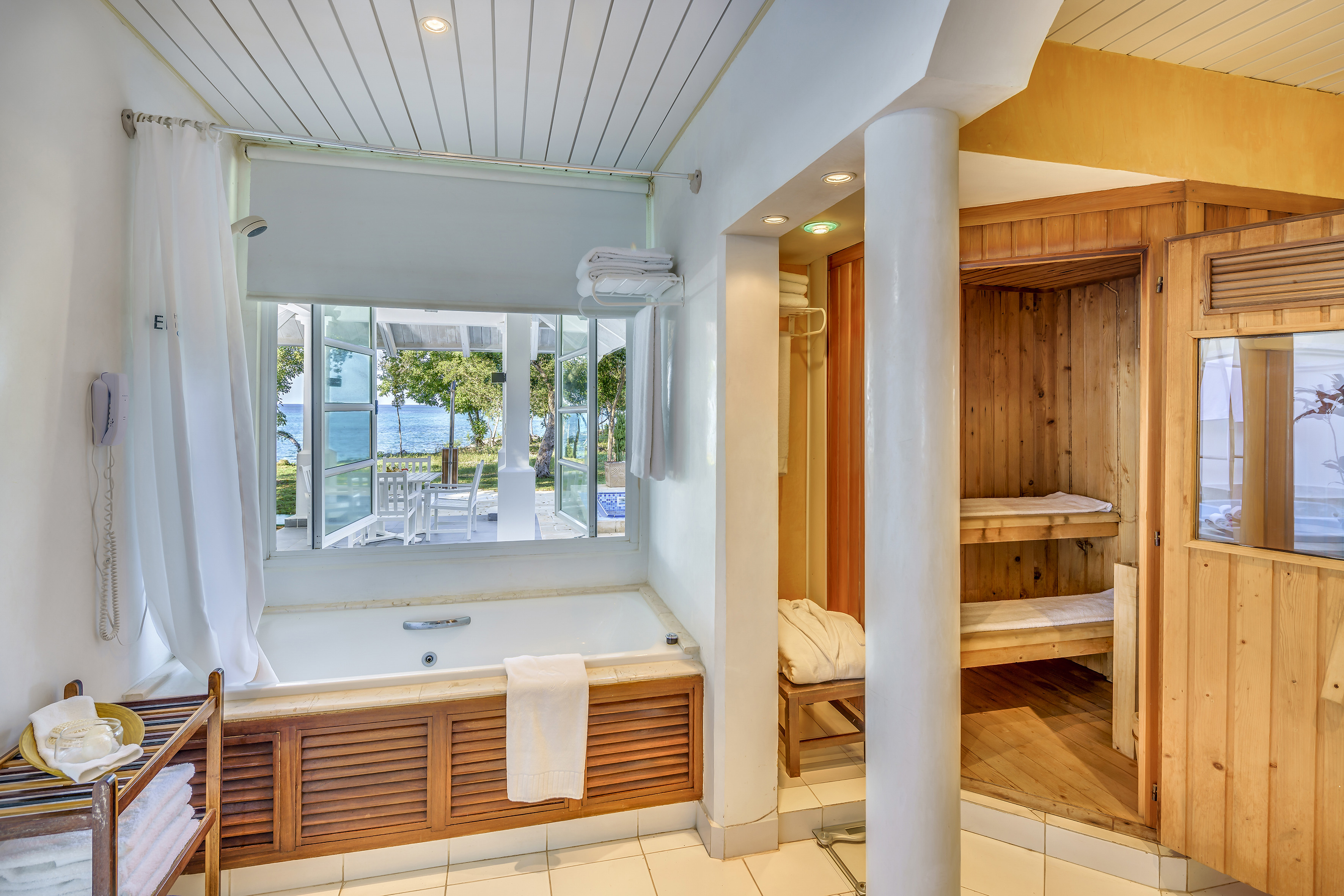 a bathroom with a bathtub and a tub