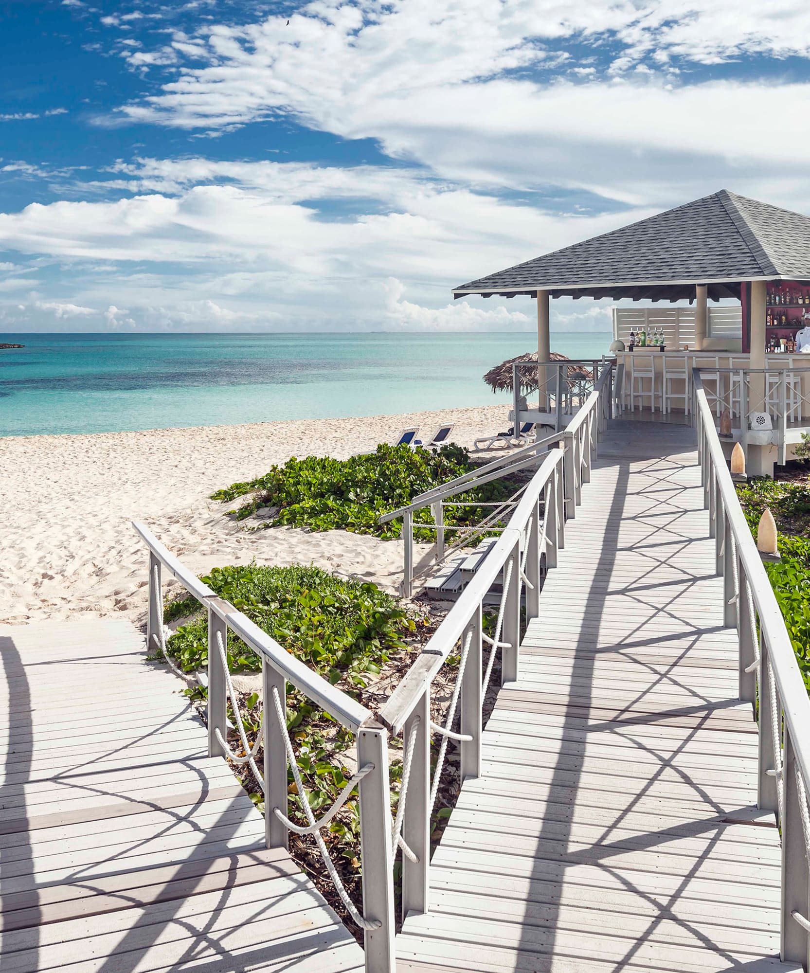 a walkway leading to a beach