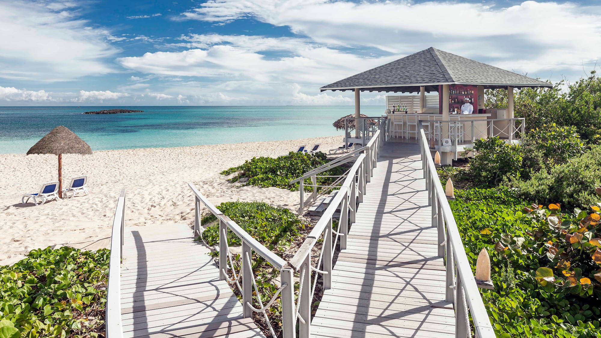 a walkway leading to a beach