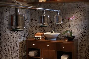 a bathroom with a sink and shelves