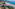a beach with trees and buildings