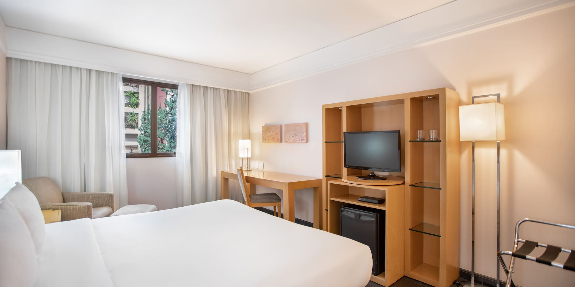 a room with a bed and a tv