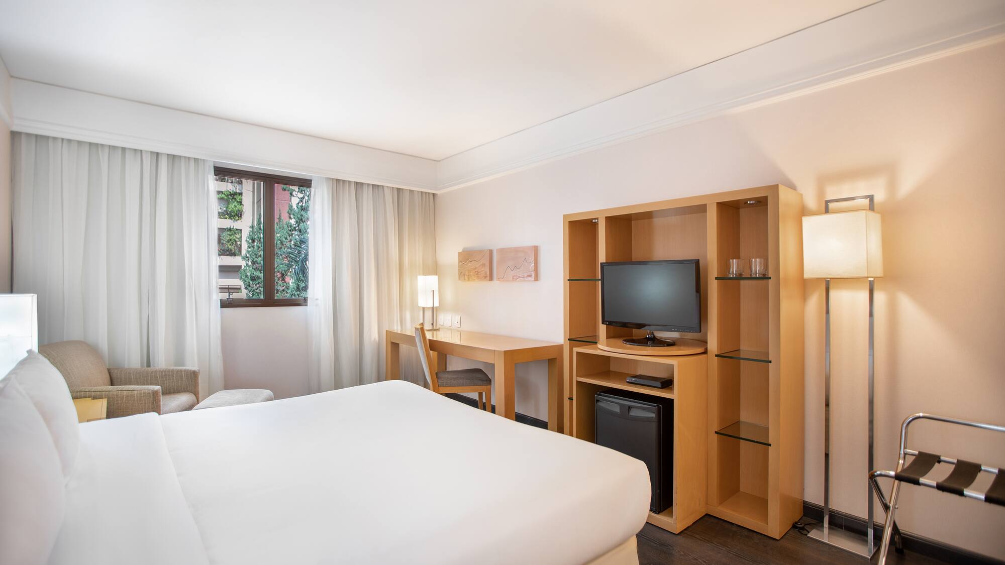 a room with a bed and a tv