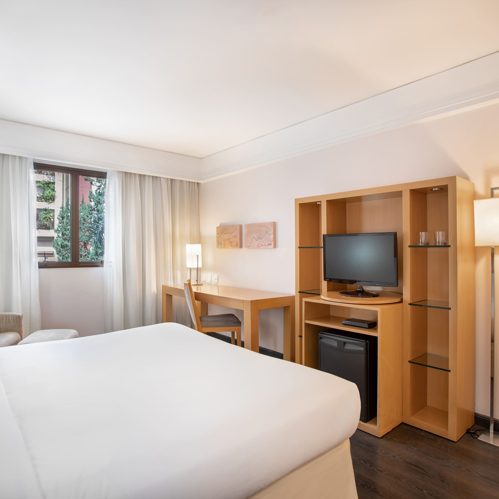 a room with a bed and a tv