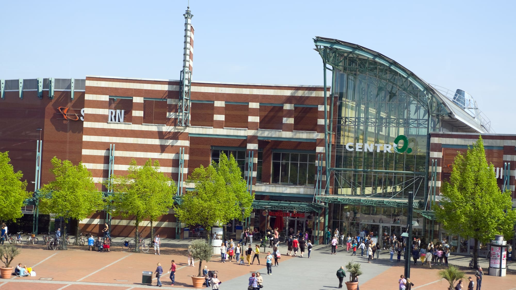 a large building with many people walking around