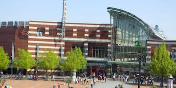 a large building with many people walking around
