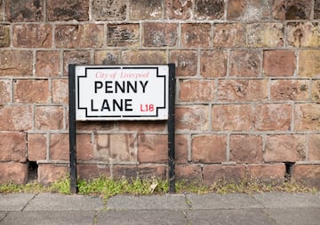 a sign on a brick wall