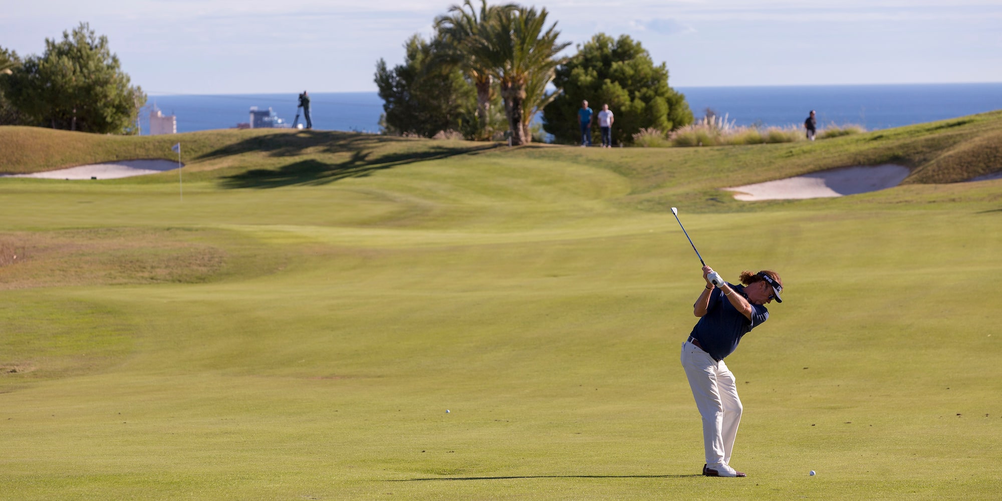 a man swinging a golf club