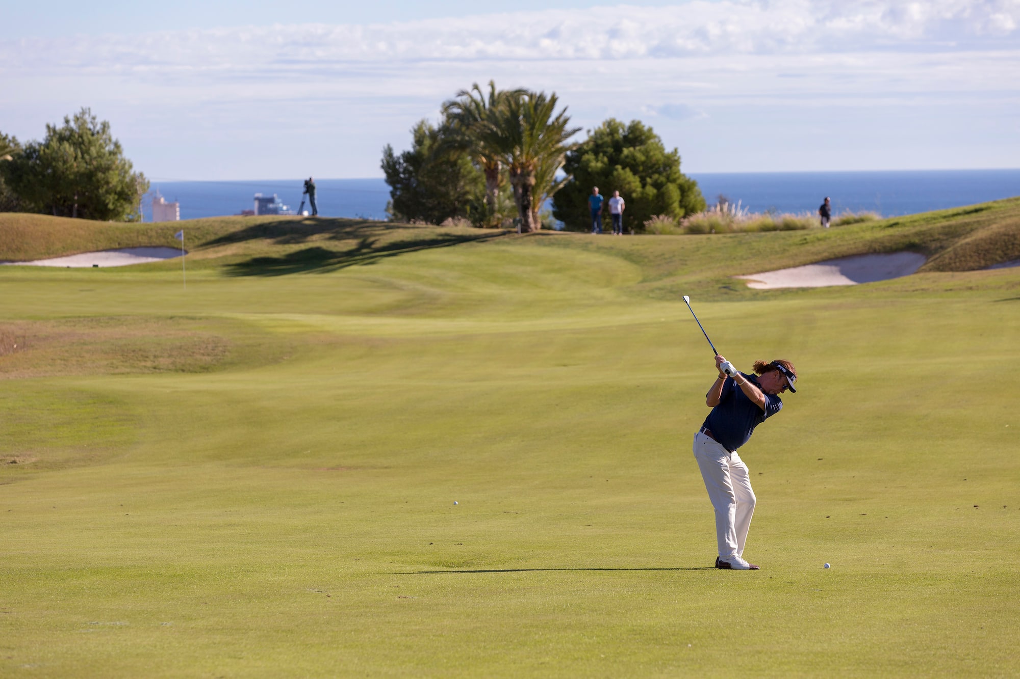 a man swinging a golf club