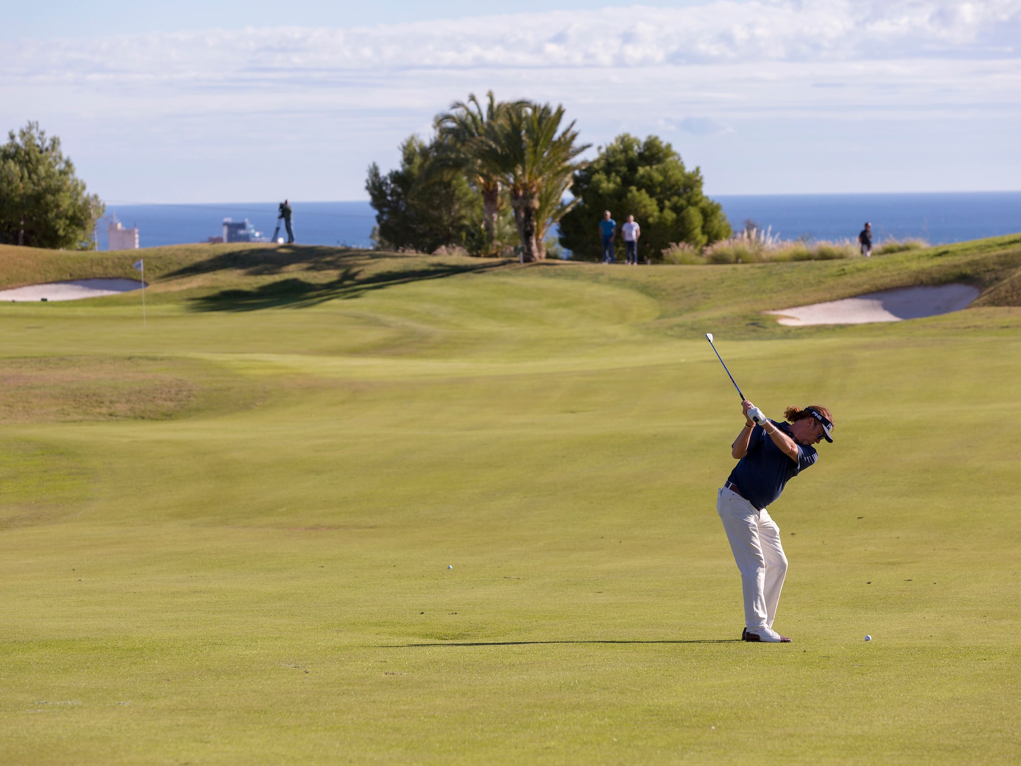 a man swinging a golf club