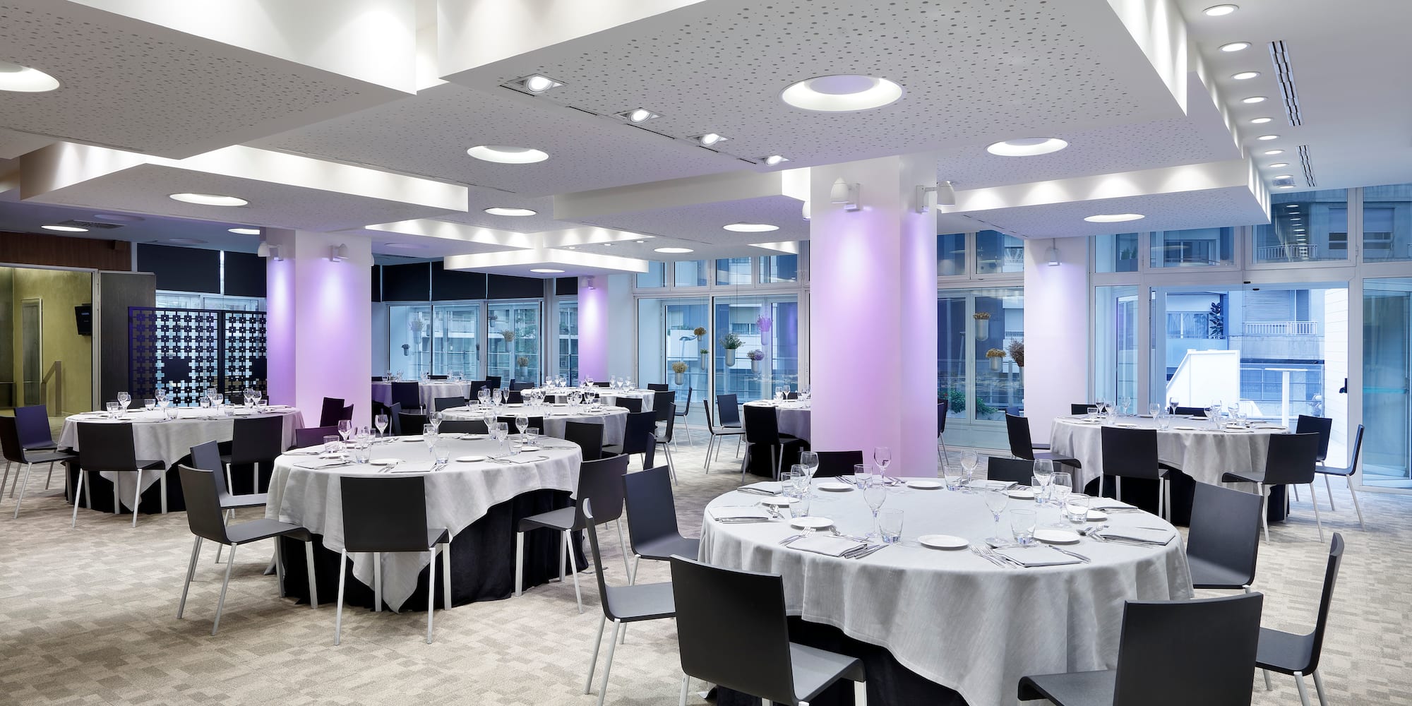 a room with tables and chairs