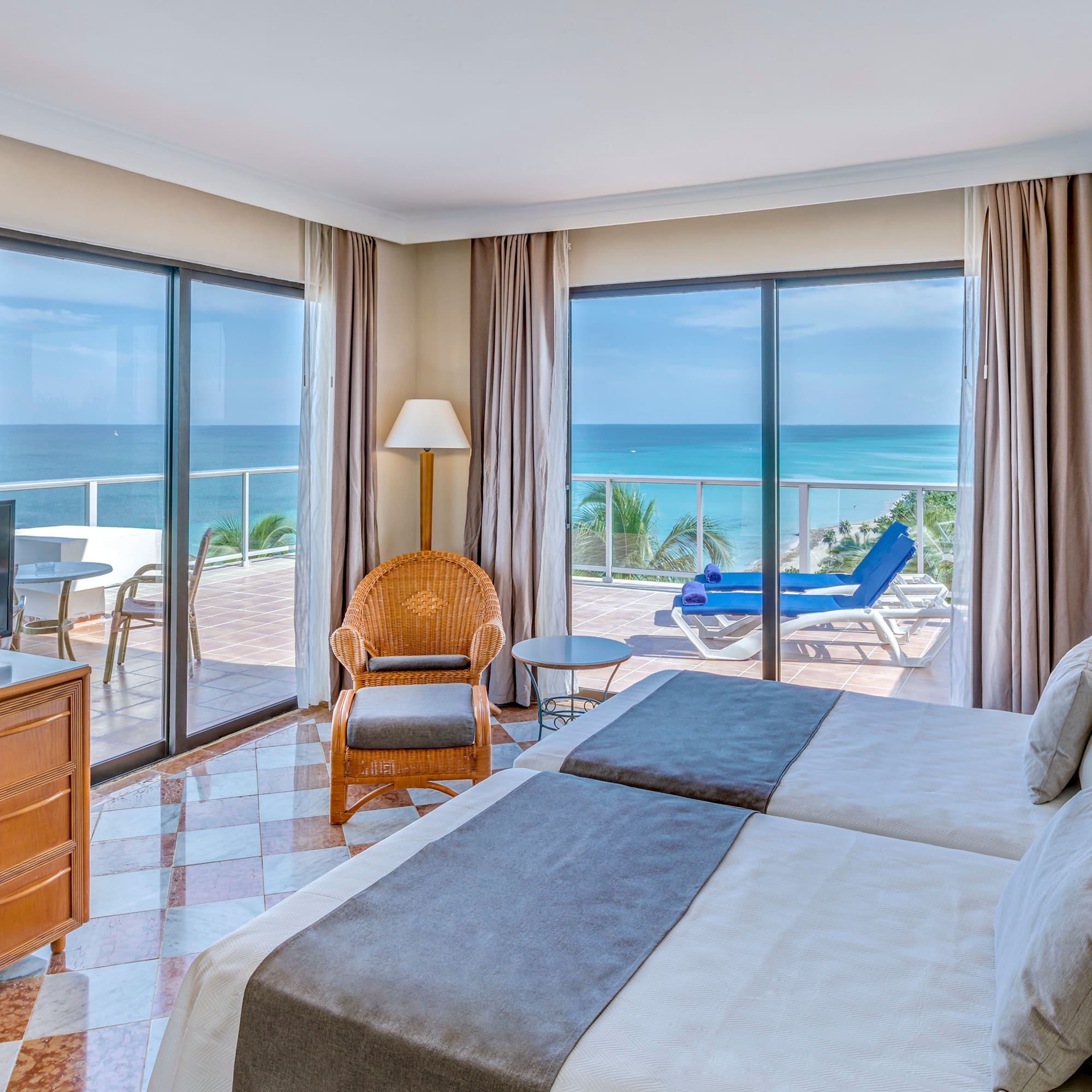 a room with two beds and a television