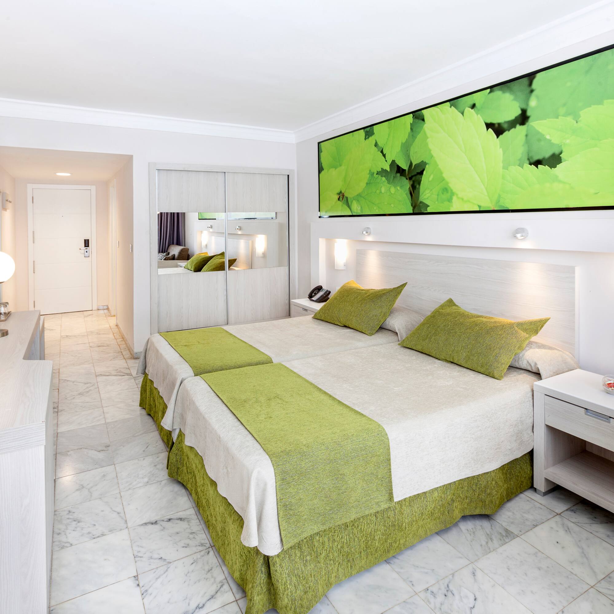 a room with a bed and a mirror