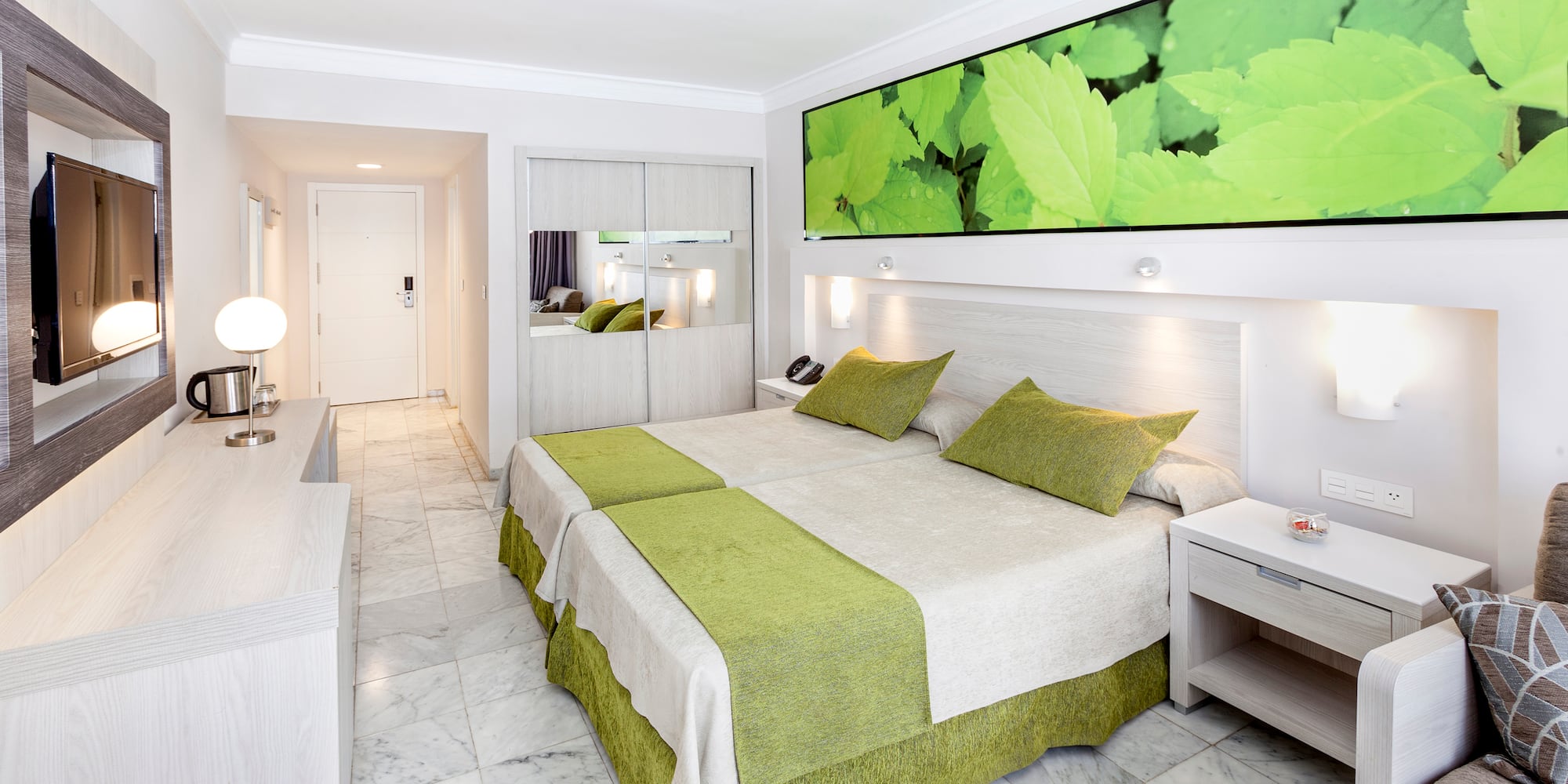 a room with a bed and a mirror