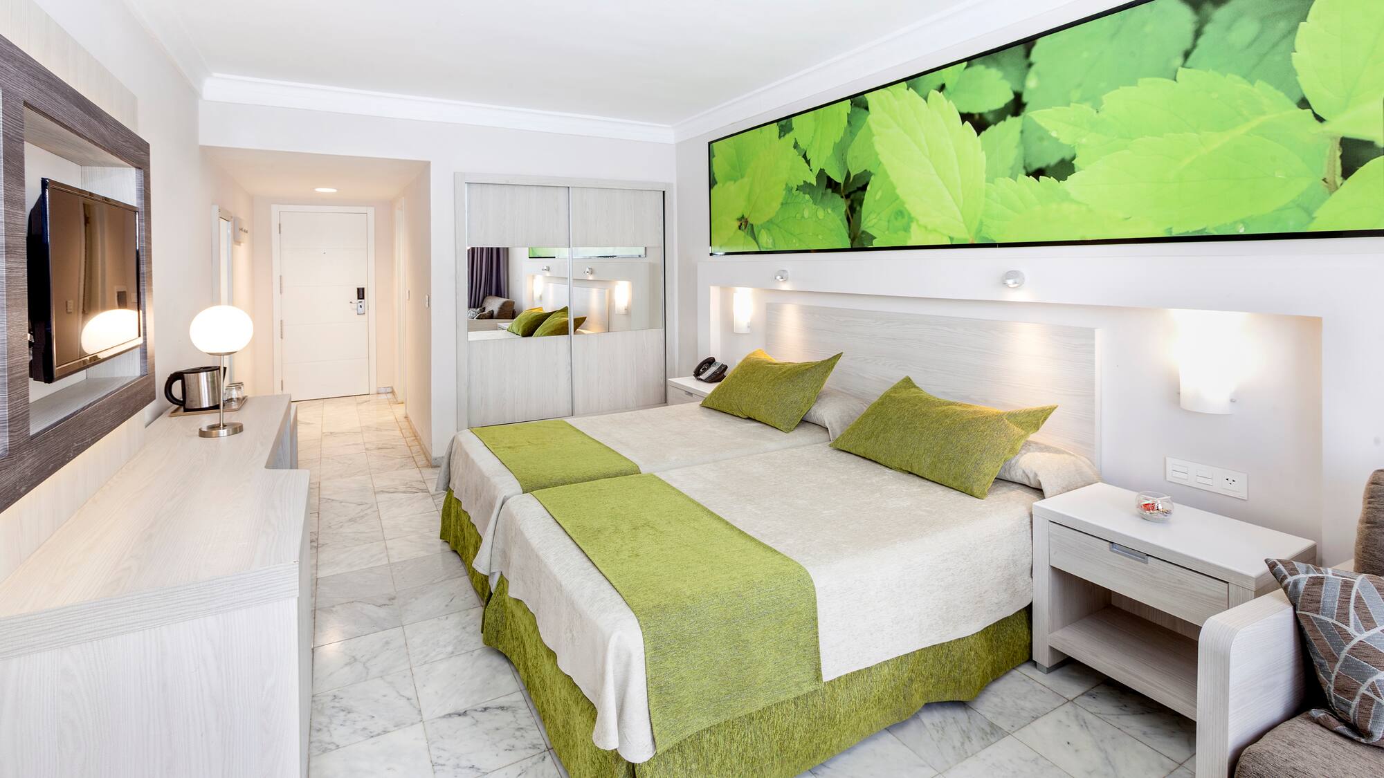 a room with a bed and a mirror