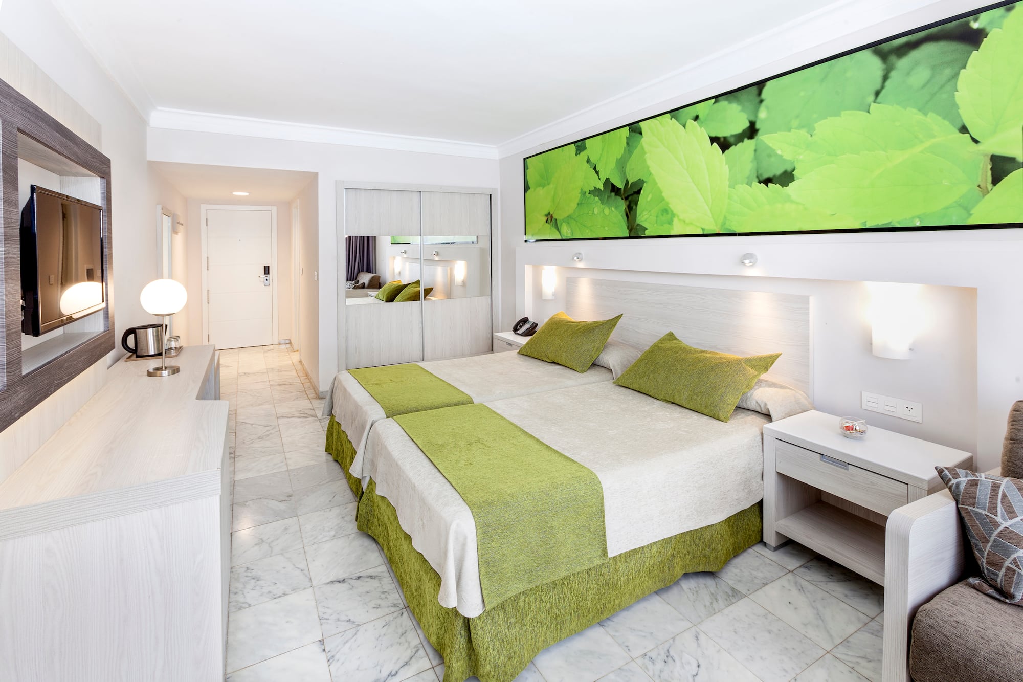 a room with a bed and a mirror