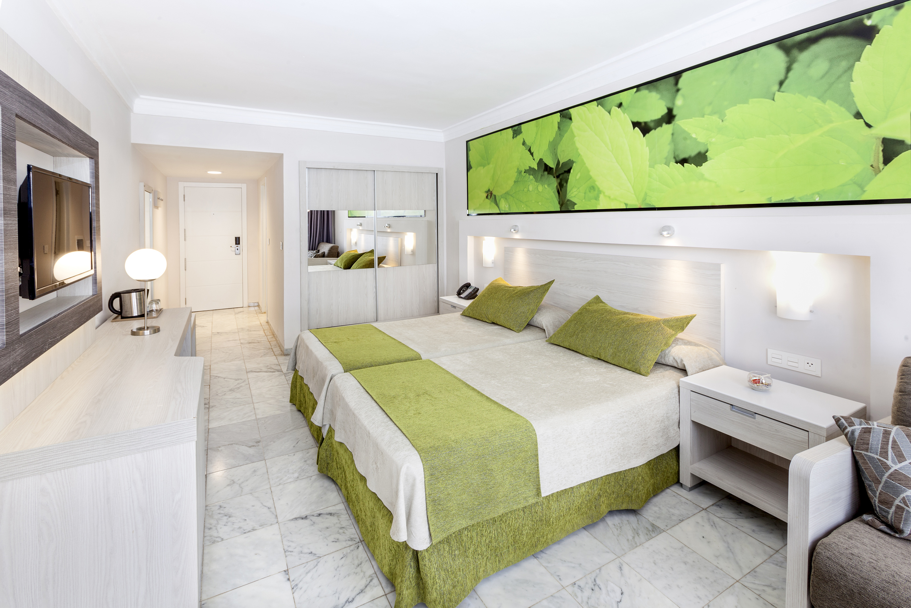 a room with a bed and a mirror