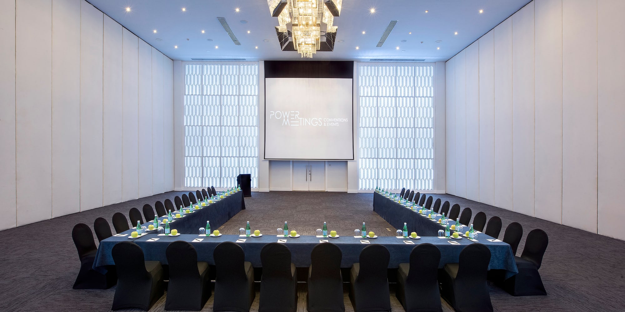 a large conference room with a large screen