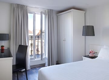 a bedroom with a bed and a chair