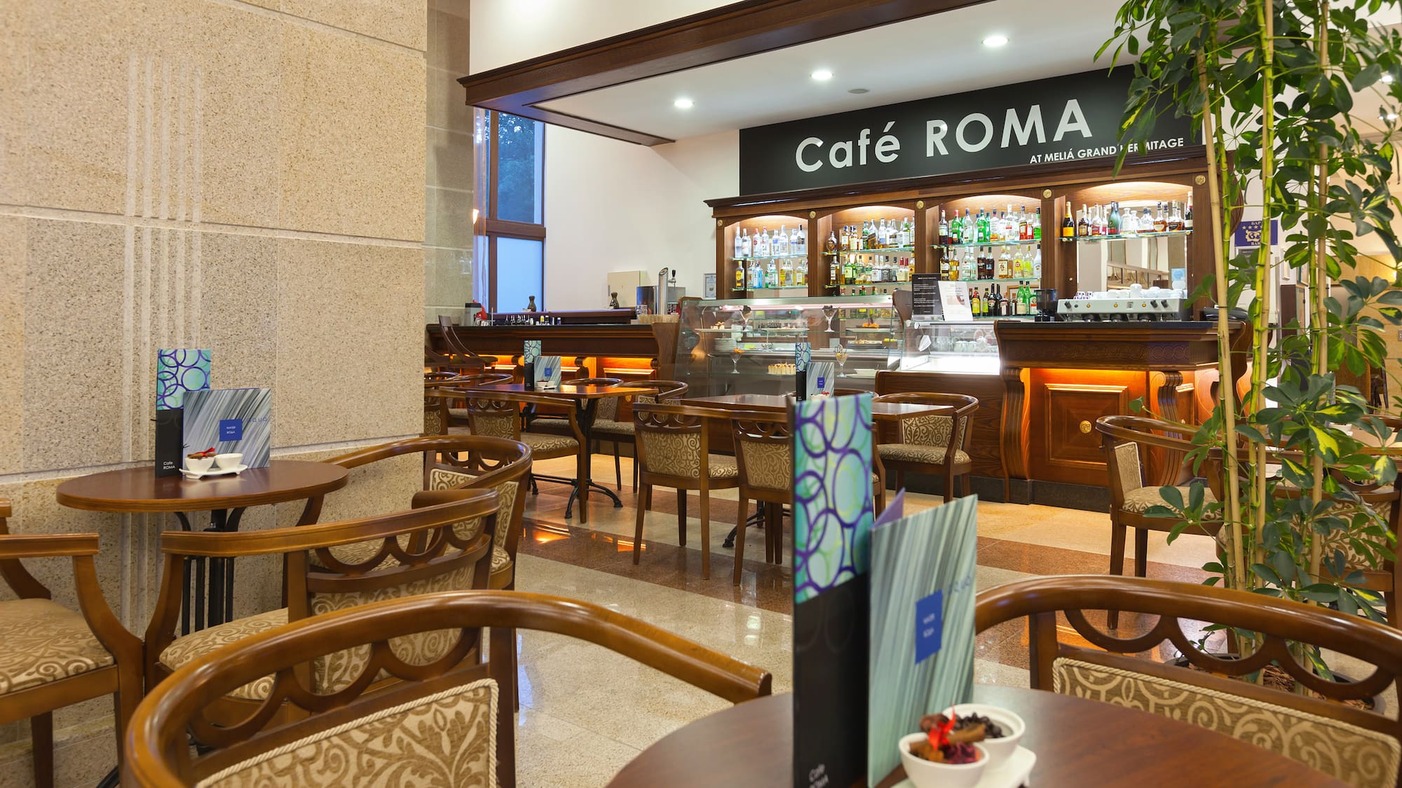 a restaurant with tables and chairs