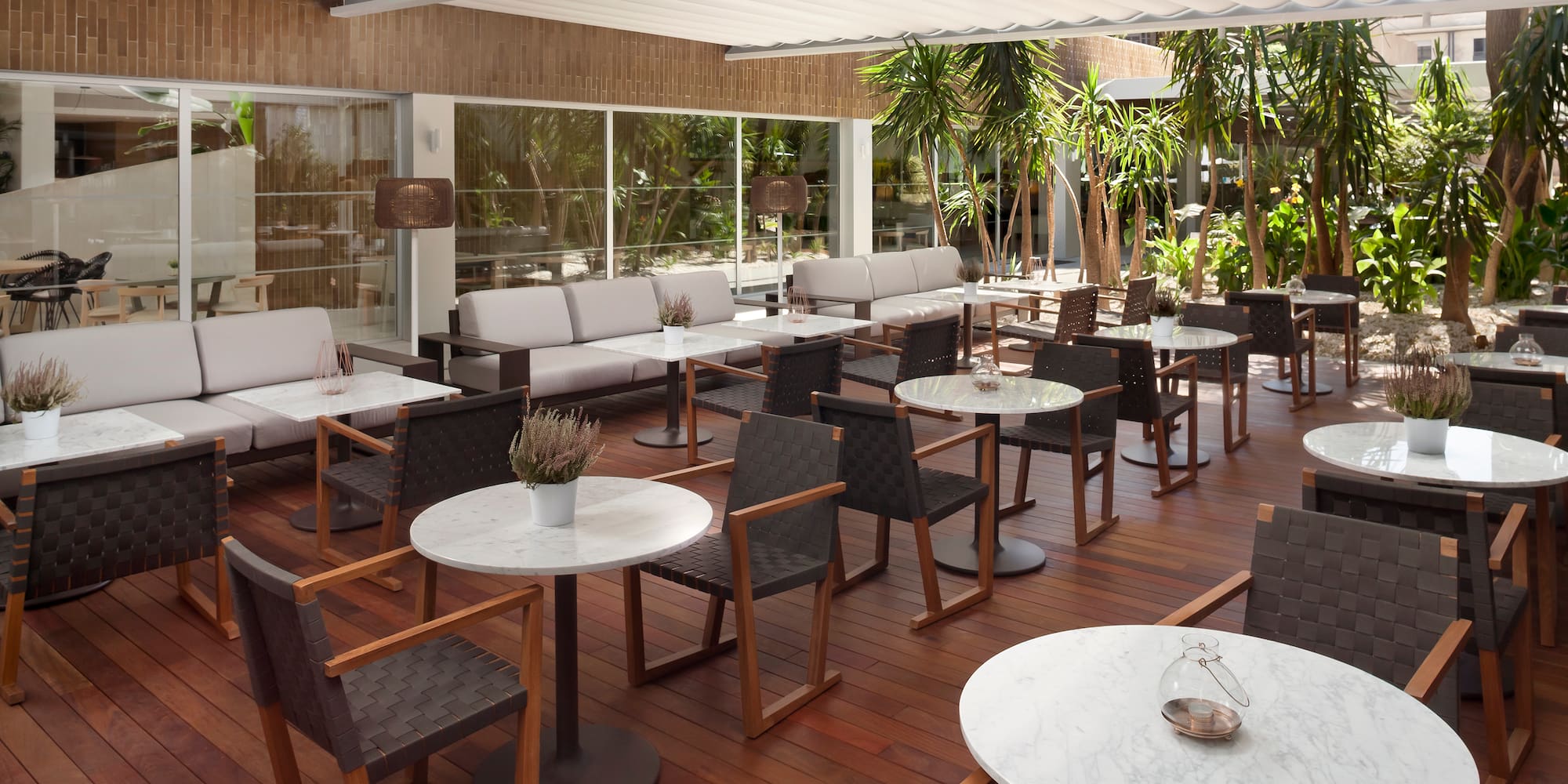 a patio area with tables and chairs