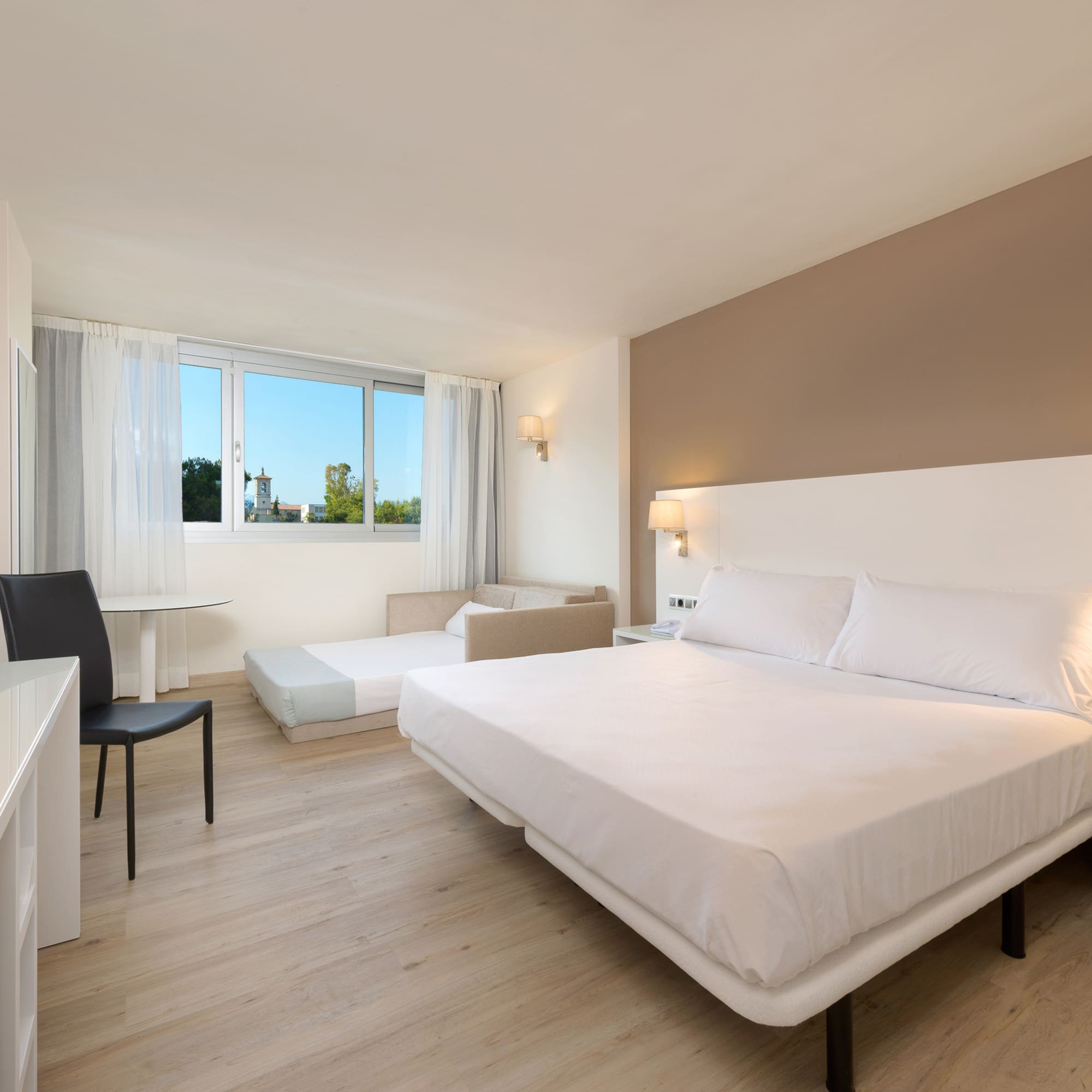 a room with a bed and a desk