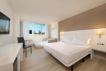 a room with a bed and a desk