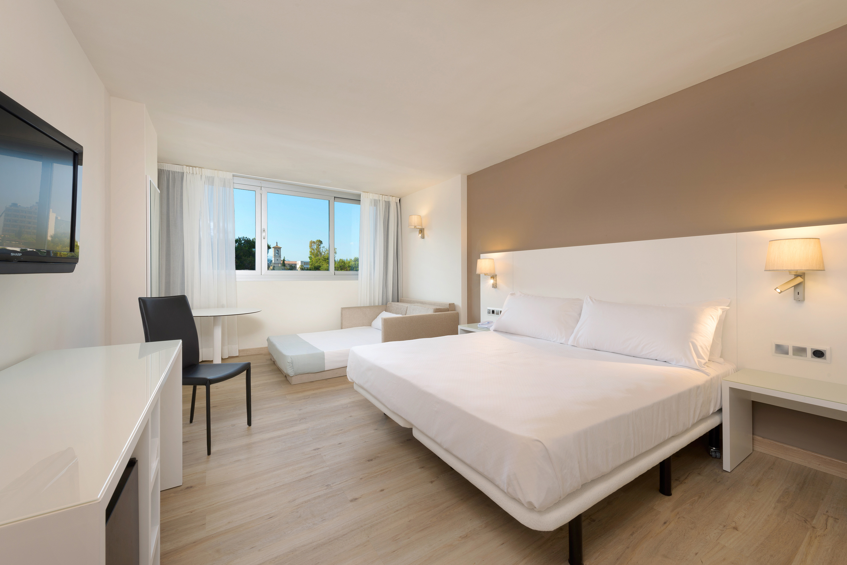 a room with a bed and a desk