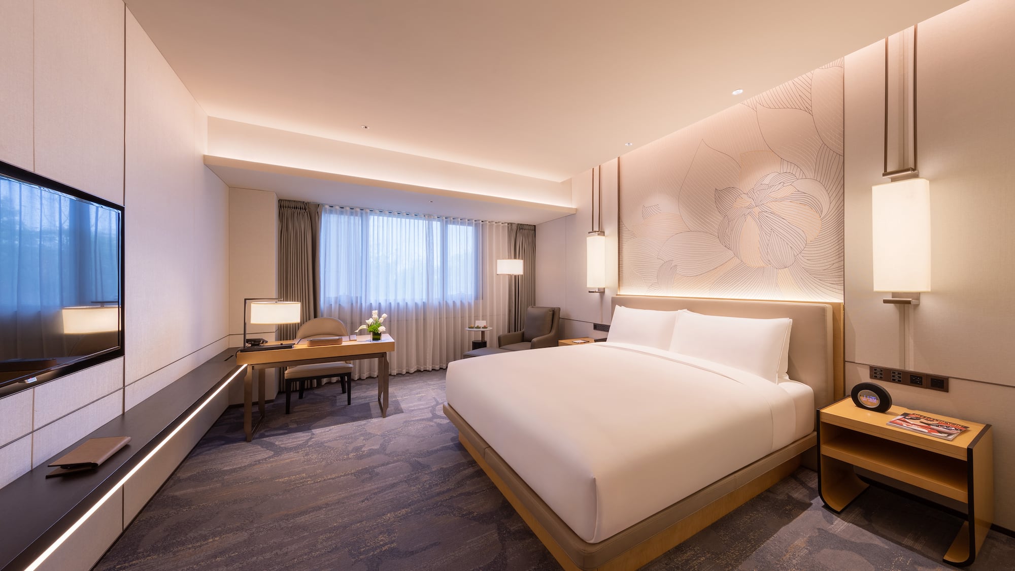 a room with a bed and a desk