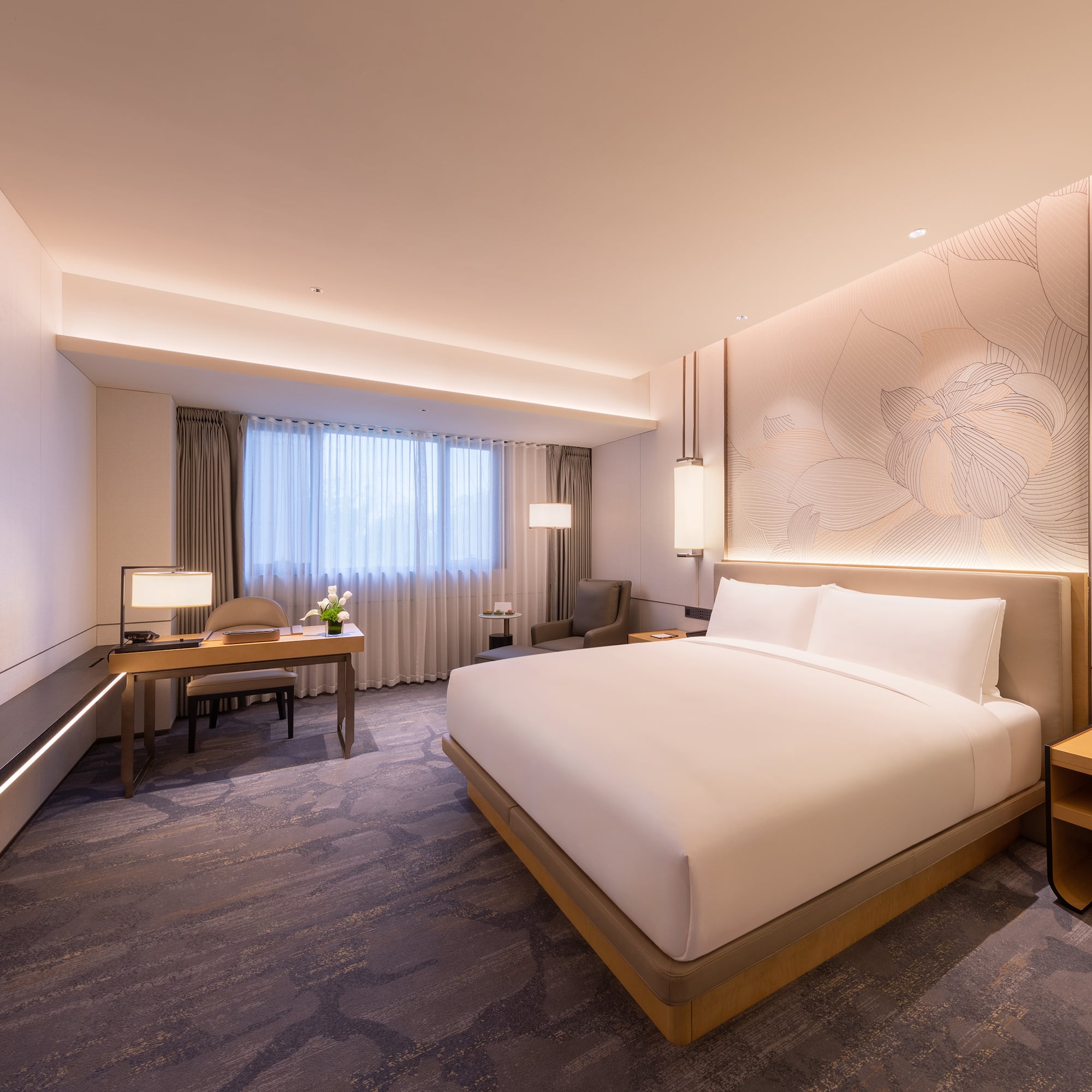 a room with a bed and a desk