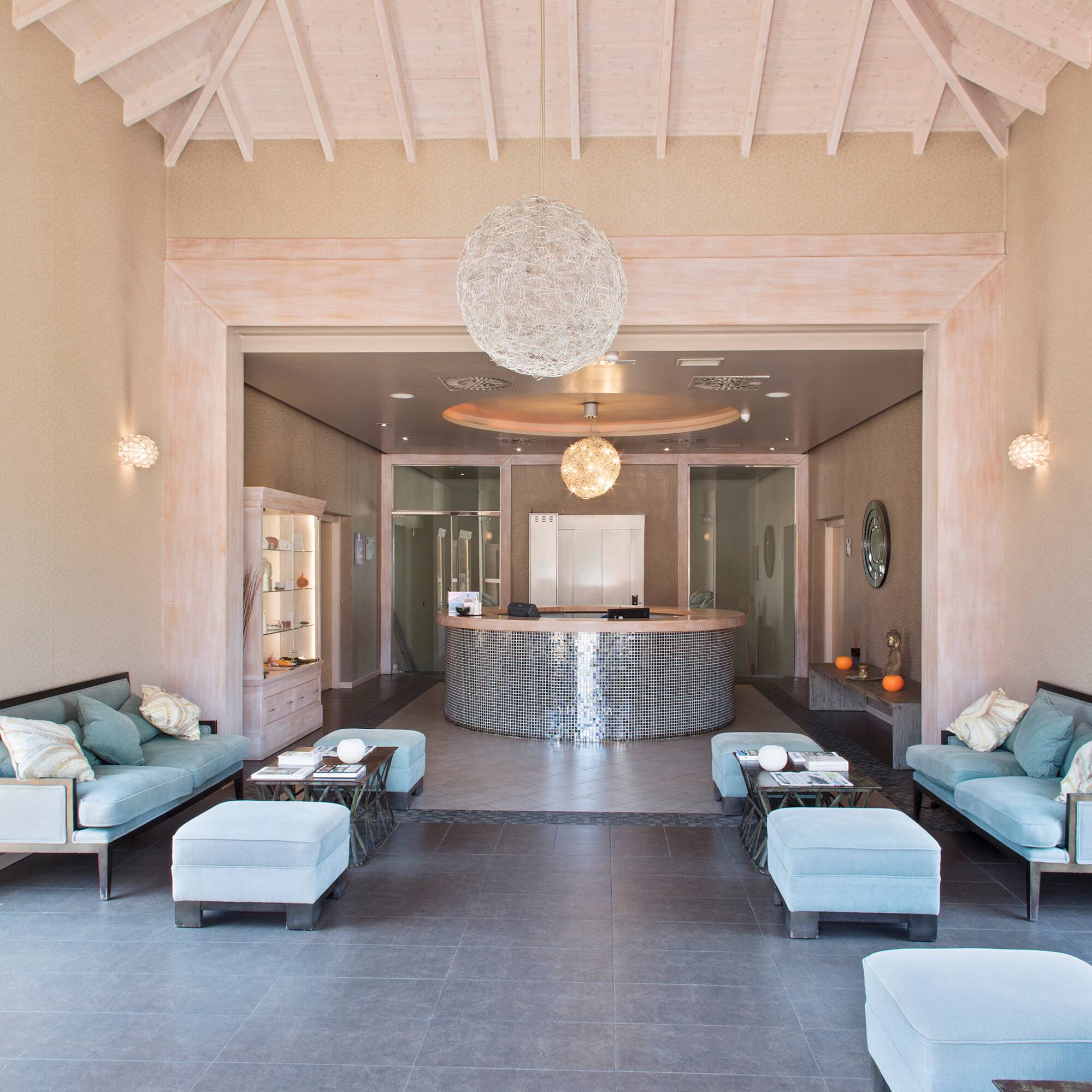 a room with a reception desk and couches
