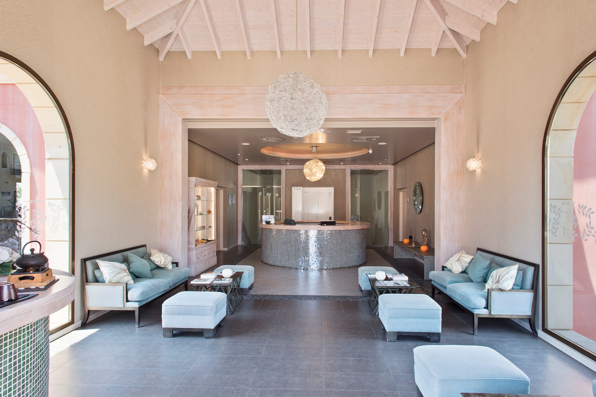 a room with a reception desk and couches