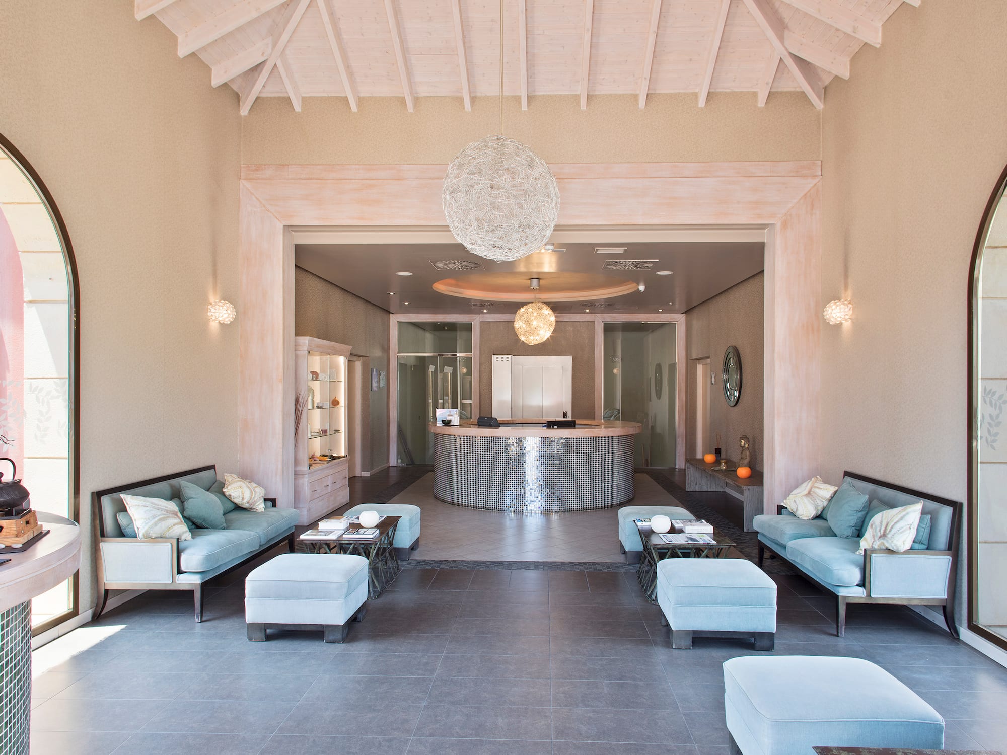 a room with a reception desk and couches