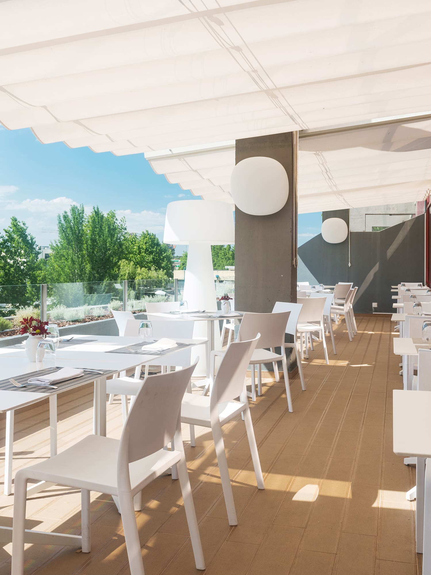 a white tables and chairs on a deck