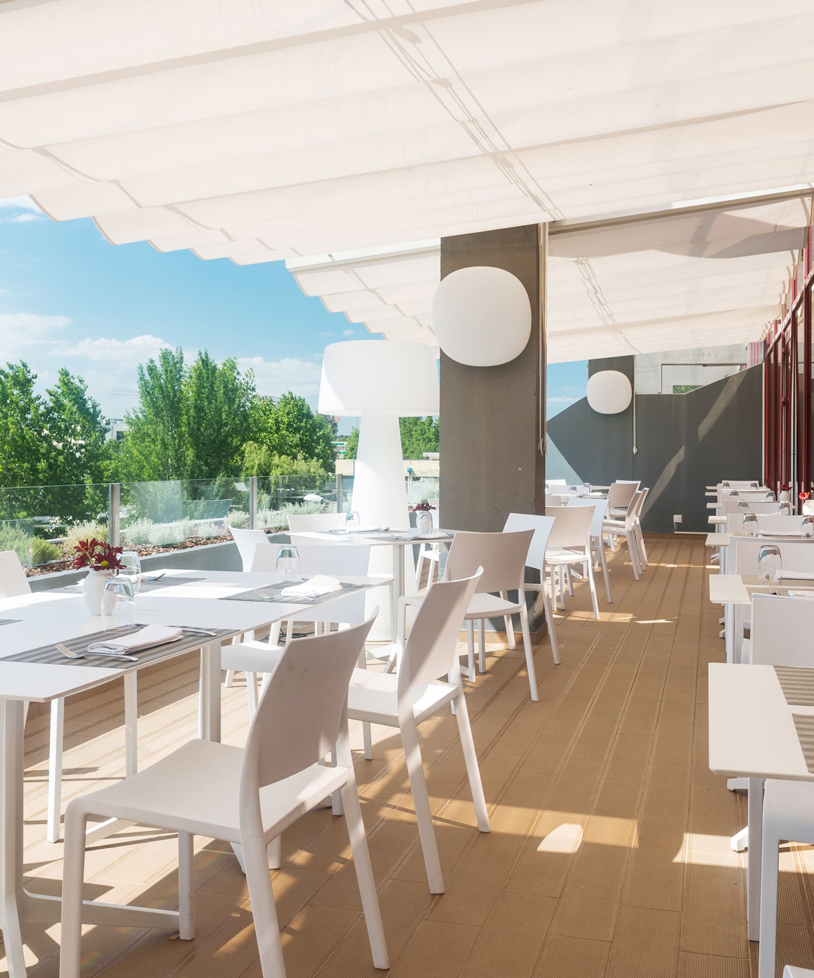a white tables and chairs on a deck