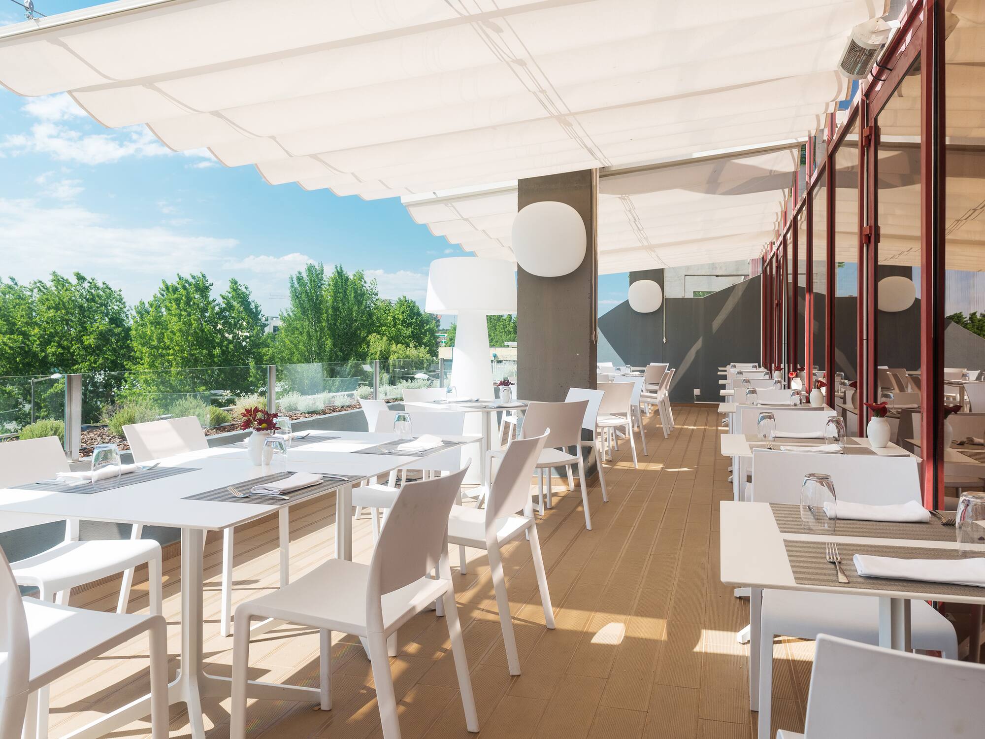 a white tables and chairs on a deck