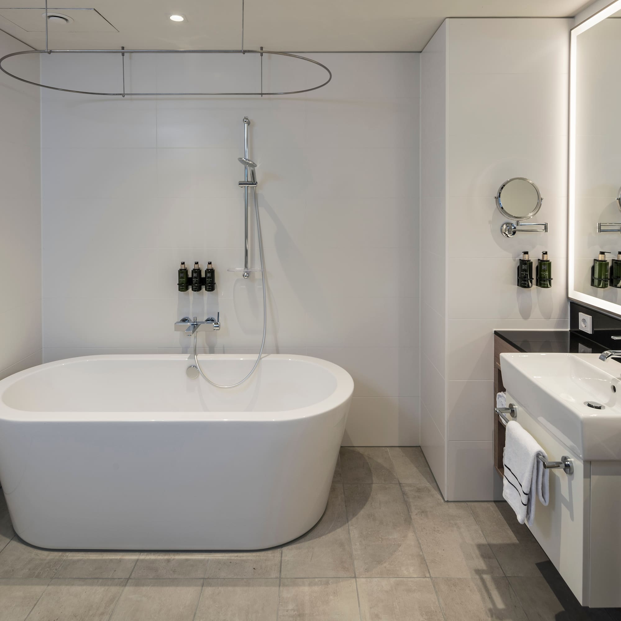 a bathroom with a tub and sink