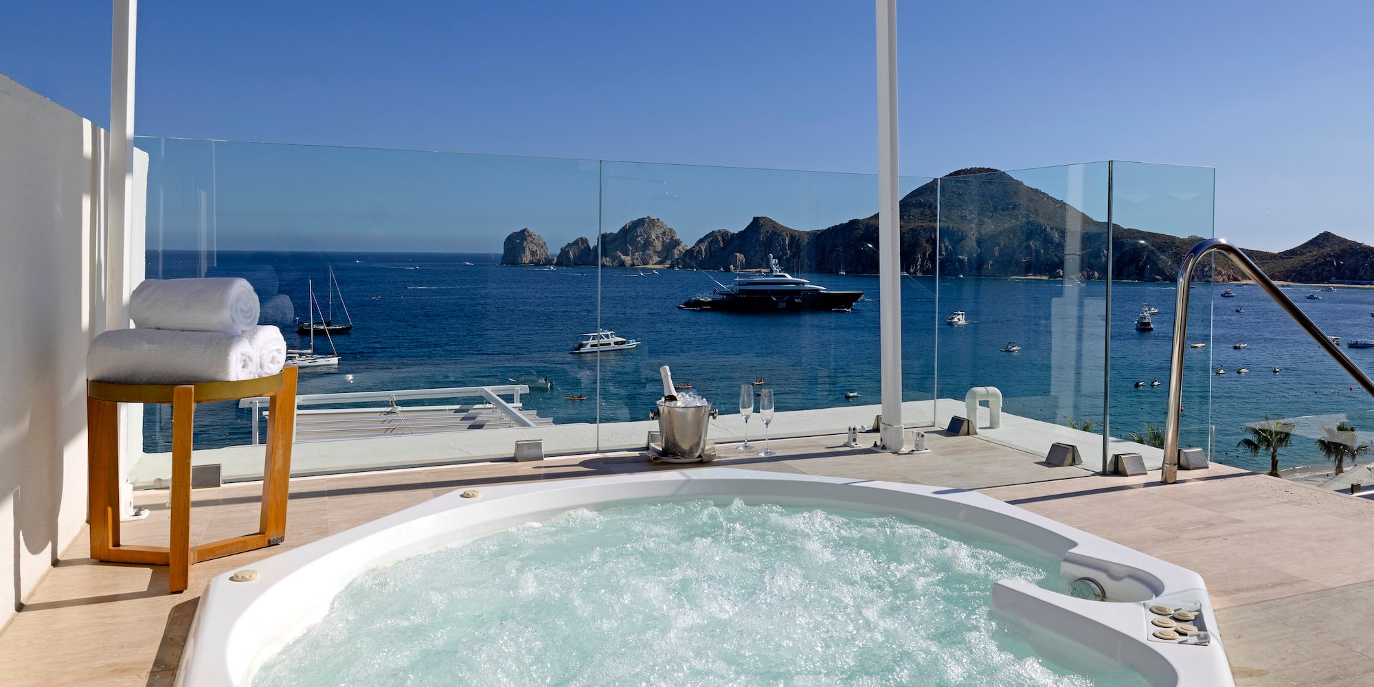 a hot tub with a view of the ocean